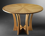 Round dining table in ripple sycamore